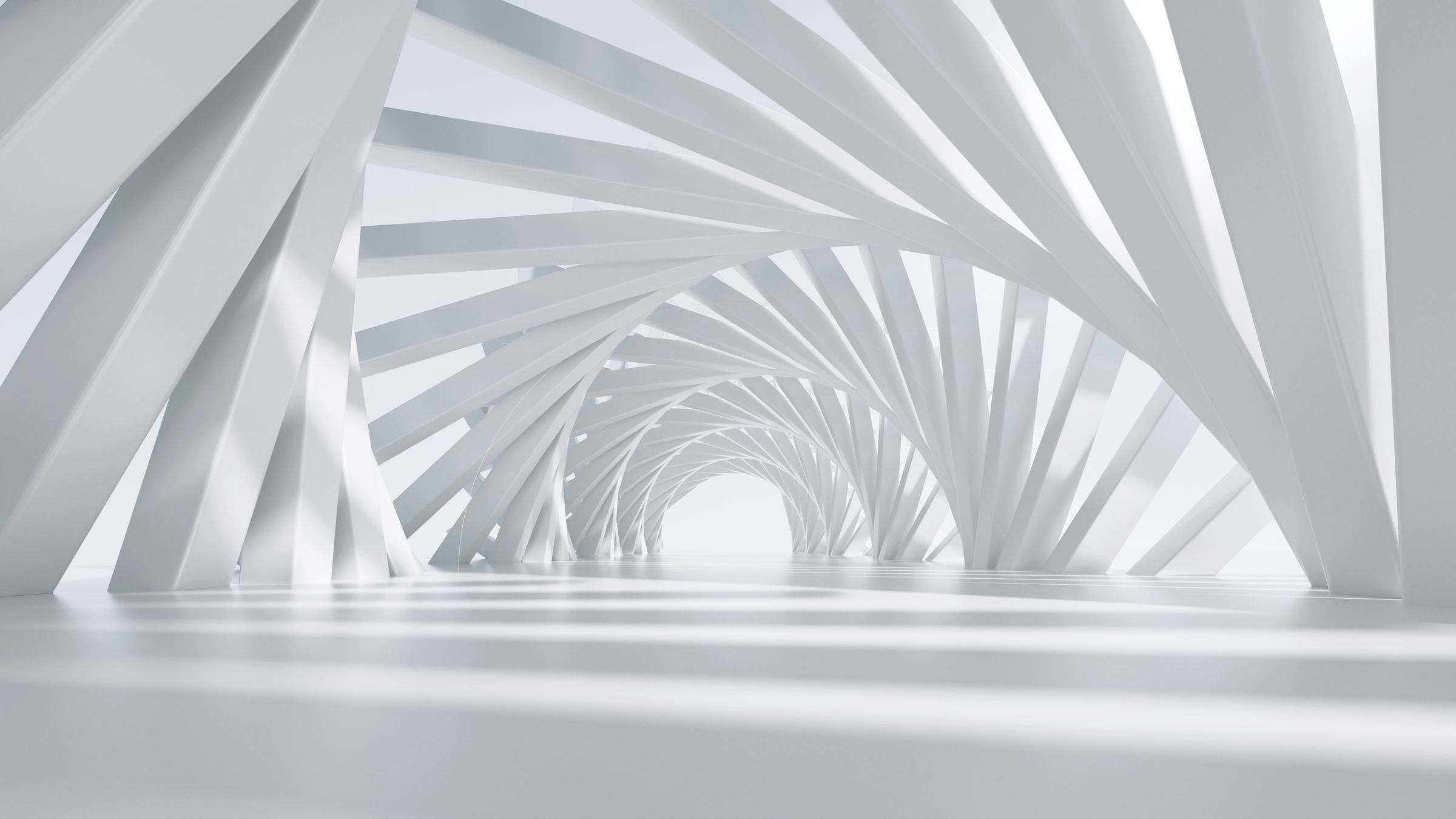 Curving corridor of white architectural beams